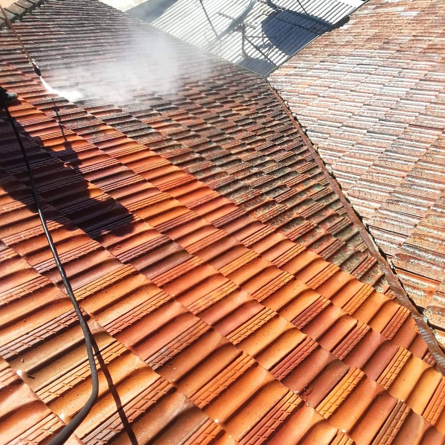 Part Way Through A Tile Roof Cleaning Project Pressure Washing Specialist POV