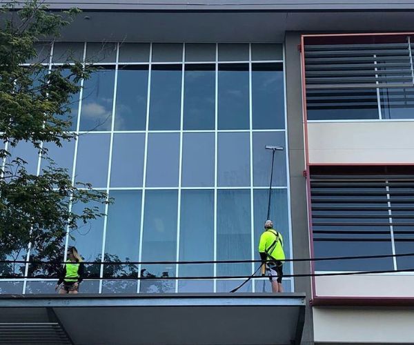 Two Professionals On A Commercial Pressure Cleaning Project